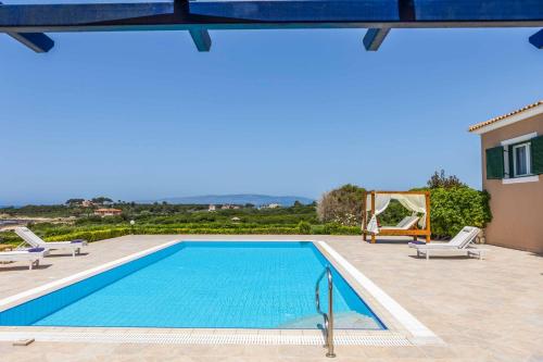 a swimming pool in a villa with a view at Villa Alba Minies in Minia