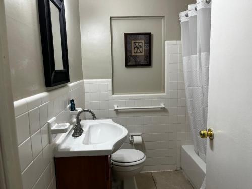 a white bathroom with a sink and a toilet at Park View East in Lakeland