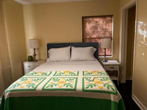 a bedroom with a bed with a quilt on it at Park View East in Lakeland