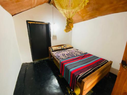 Postel nebo postele na pokoji v ubytování Jama’s Stay