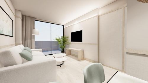 a living room with white furniture and a large window at Dynastic Rooms Apartments in Benidorm