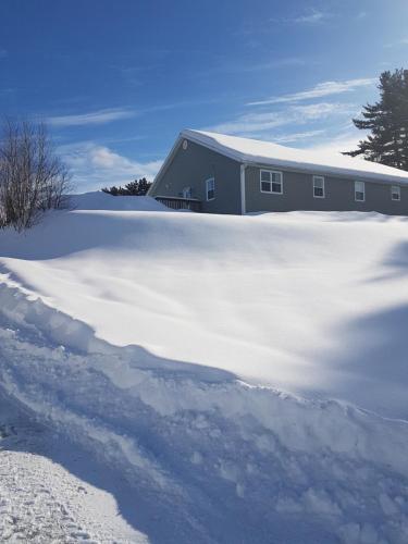 a pile of snow in front of a building at Stay Awhile in Perth