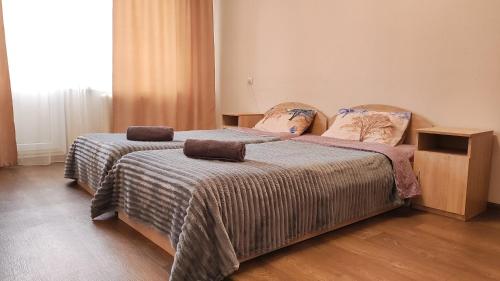 two beds in a hotel room with two at Водопійна 19 CityRooms in Bila Tserkva