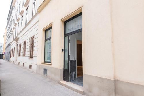 a store window on a building on a street at Beatrix Home Vienna Luxury Stay in Vienna