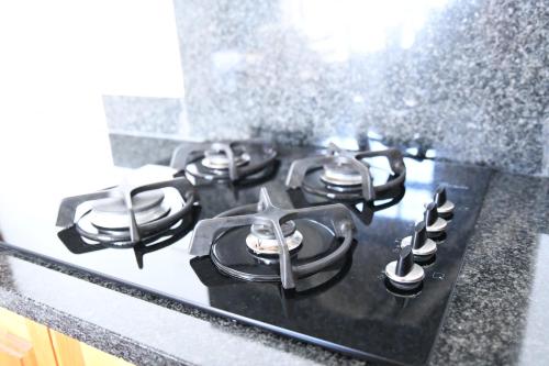 a stove top with four burners on a counter at Bonnie View Game Lodge in Hilton