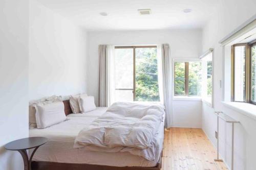 Cama o camas de una habitación en 暮らしを創る家soco