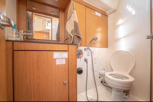a small bathroom with a toilet and a shower at Hka Neta Yachting in Göcek
