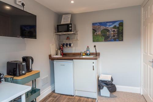 Kuchyň nebo kuchyňský kout v ubytování Union Street Suites