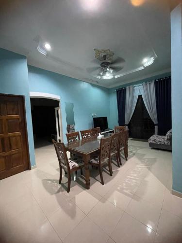 a dining room with a table and chairs at DnD Homestay in Kuala Berang