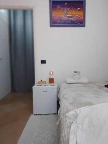 Ένα ή περισσότερα κρεβάτια σε δωμάτιο στο Stanza Porolla - matrimoniale con bagno privato