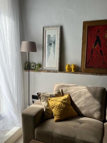 a living room with a couch and a window at Lemon House in Vélez-Málaga