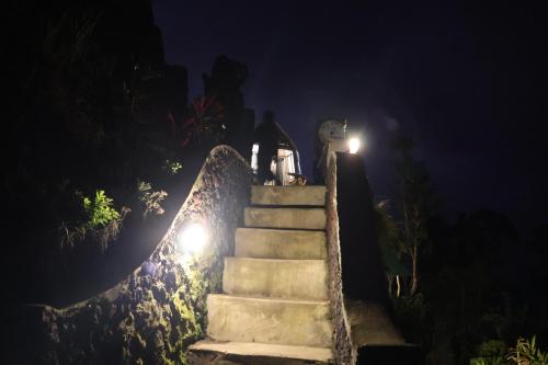 a set of stairs at night with lights at Bali Sunrise Camp & Glamping in Kintamani