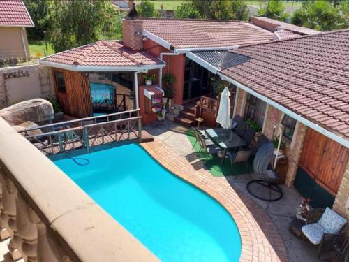 an overhead view of a swimming pool in a backyard at Le Chef BnB in Mthatha