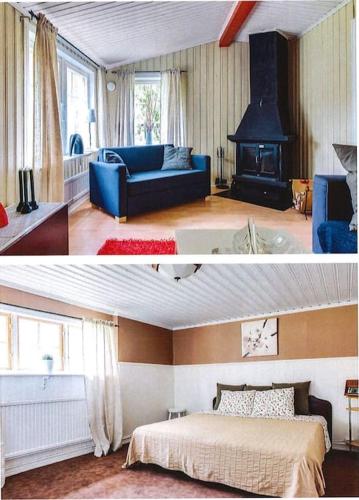 een woonkamer met een blauwe bank en een open haard bij Eden (Natur & lugnet) in Örebro