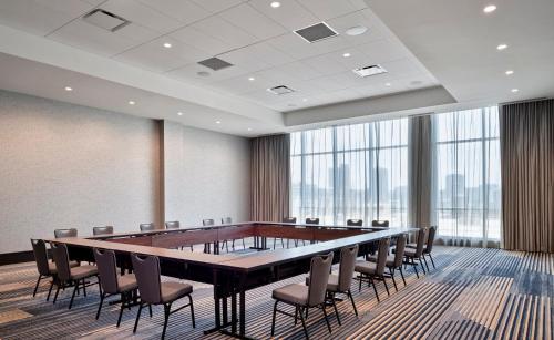 a conference room with a large table and chairs at Loews Kansas City in Kansas City