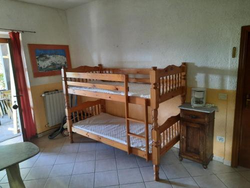 a couple of bunk beds in a room at Casa del Lupo in Bagnone