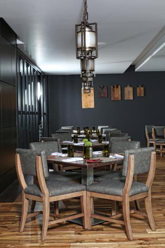 a dining room with a table and chairs at Loews Atlanta Hotel in Atlanta