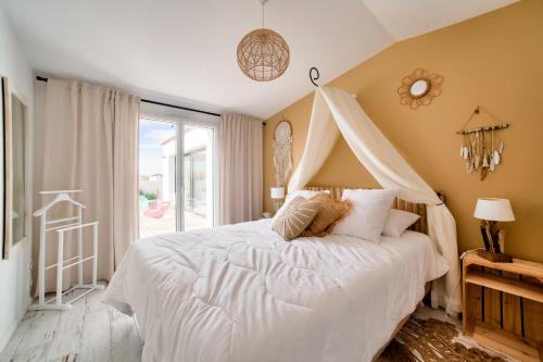 Posteľ alebo postele v izbe v ubytovaní Maison pour 9 - Jacuzzi - 300m de la plage