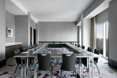 a conference room with a long table and chairs at Loews Atlanta Hotel in Atlanta