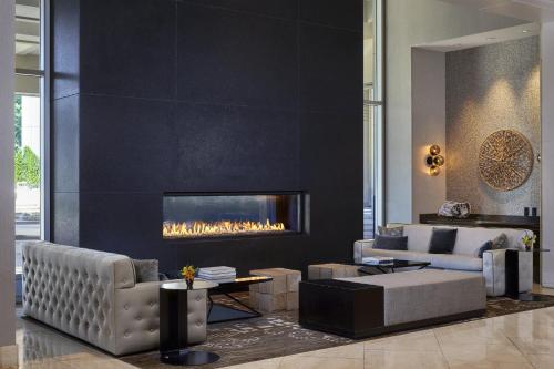 a living room with a couch and a fireplace at Loews Vanderbilt Hotel in Nashville