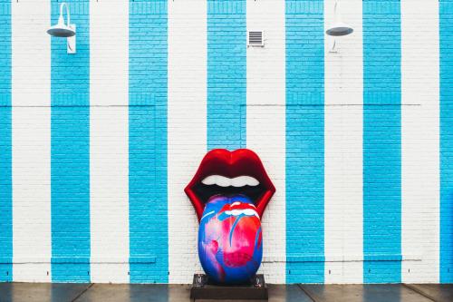 a large mouth statue in front of a wall at Loews Nashville Hotel at Vanderbilt Plaza in Nashville