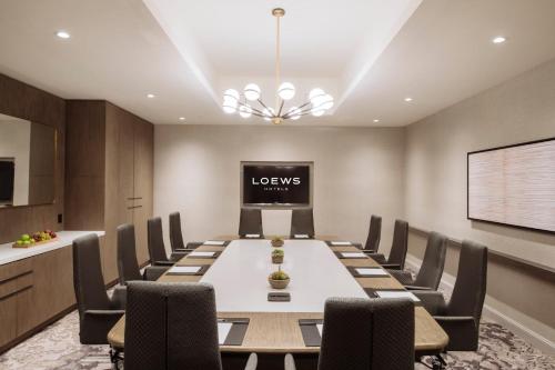 a conference room with a long table and chairs at Loews Nashville Hotel at Vanderbilt Plaza in Nashville