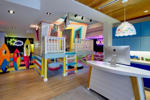 a childrens play room with a laptop on a desk at Loews Miami Beach Hotel in Miami Beach