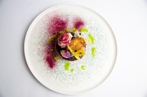 a plate of food on a white table at Nunsmere Hall Hotel in Oakmere