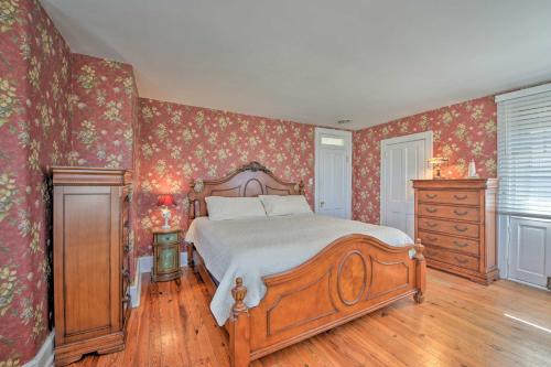 a bedroom with a large bed and a dresser and a bed sidx sidx sidx at Striking Cape May Getaway, Steps From the Beach! in Cape May