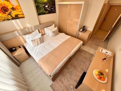 Postel nebo postele na pokoji v ubytování Şimal Hotel