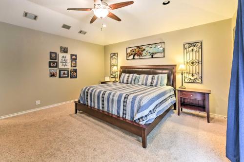 a bedroom with a bed and a ceiling fan at Quiet Lake Conroe Townhome with Water-View Deck in Willis
