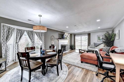 a living room with a table and chairs and a couch at Quiet/Private/Easy. Walk to restaurants/shops in Alpharetta