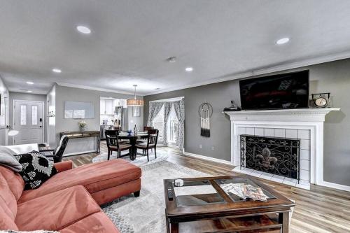 a living room with a couch and a fireplace at Quiet/Private/Easy. Walk to restaurants/shops in Alpharetta