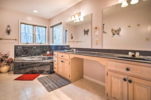 a bathroom with a large sink and a tub at Burnsville Hideaway with Deck and Panoramic Mtn Views in Burnsville