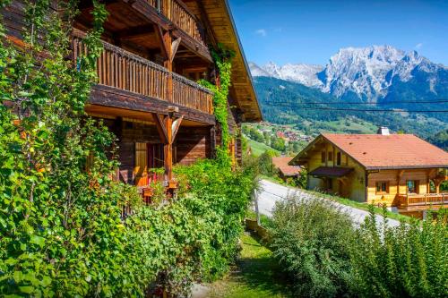 a house with a view of a mountain at Chalet Cashmere Spirit - OVO Network in Manigod