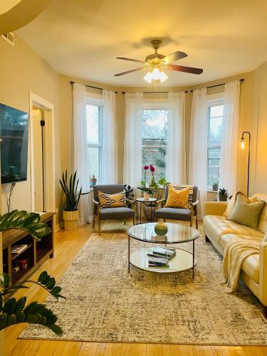 a living room with a couch and a coffee table at Sunny, Spacious, 3BR 1BA Davlin INN Chicago in Chicago