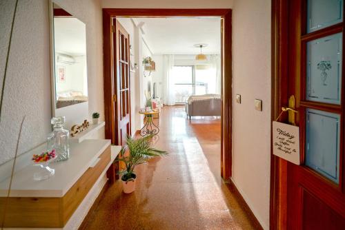 a hallway with a room with a bed and a door at El Mirador de Linarejos in Linares