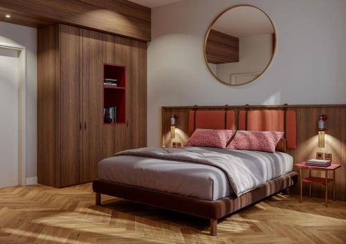 a bedroom with a large bed and a mirror at Ca' Vendramin Zago in Venice
