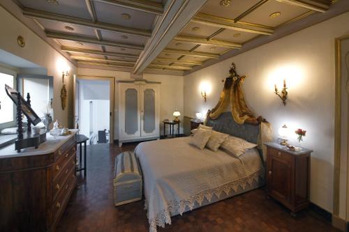 a large bedroom with a bed and a dresser at Villa Albaluce in Caluso