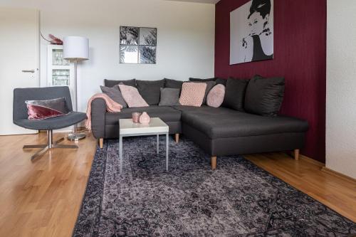 a living room with a couch and a table at Villa Schönau in Bad Münstereifel