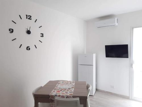 Televízia a/alebo spoločenská miestnosť v ubytovaní Casa vacanze Bia Blu