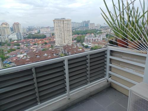 a balcony with a view of a city at SY Staycation - Studio in Bayan Lepas