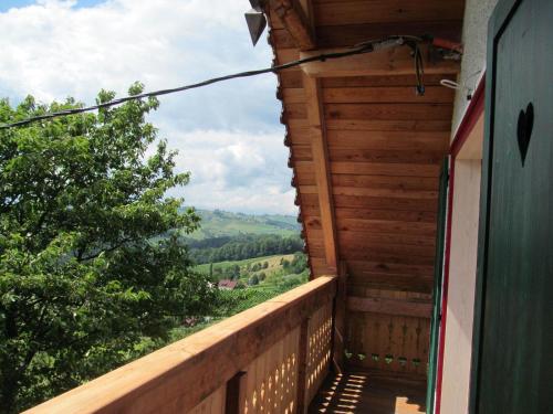 a balcony with a view of the mountains at Holiday Home Sonnenhaus in Svečina