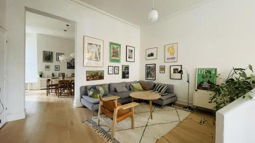 a living room with a couch and a table at ApartmentInCopenhagen Apartment 1439 in Hellerup