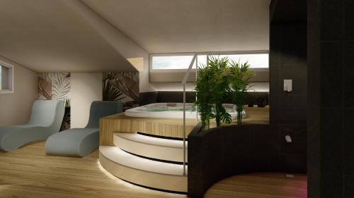 a bedroom with a bed with a window at Hotel Villa Eugenia - 3 Stelle Superior con Private SPA e Piscina in Lido di Jesolo