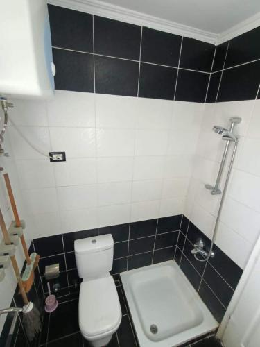 a bathroom with a white toilet and a sink at Flat for rent in Sharm El Sheikh