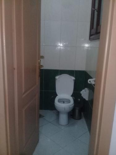 a bathroom with a white toilet in a room at Flat for rent in Sharm El Sheikh