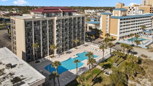 an aerial view of the resort with a pool and buildings at Ocean Crest Inn and Suites in Myrtle Beach