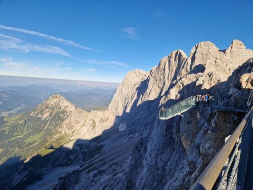 a train on the side of a mountain at Appartement am Hauser Kaibling in Haus im Ennstal