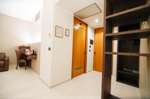 a living room with a staircase leading to a loft at Hotel Diplomatic in Turin